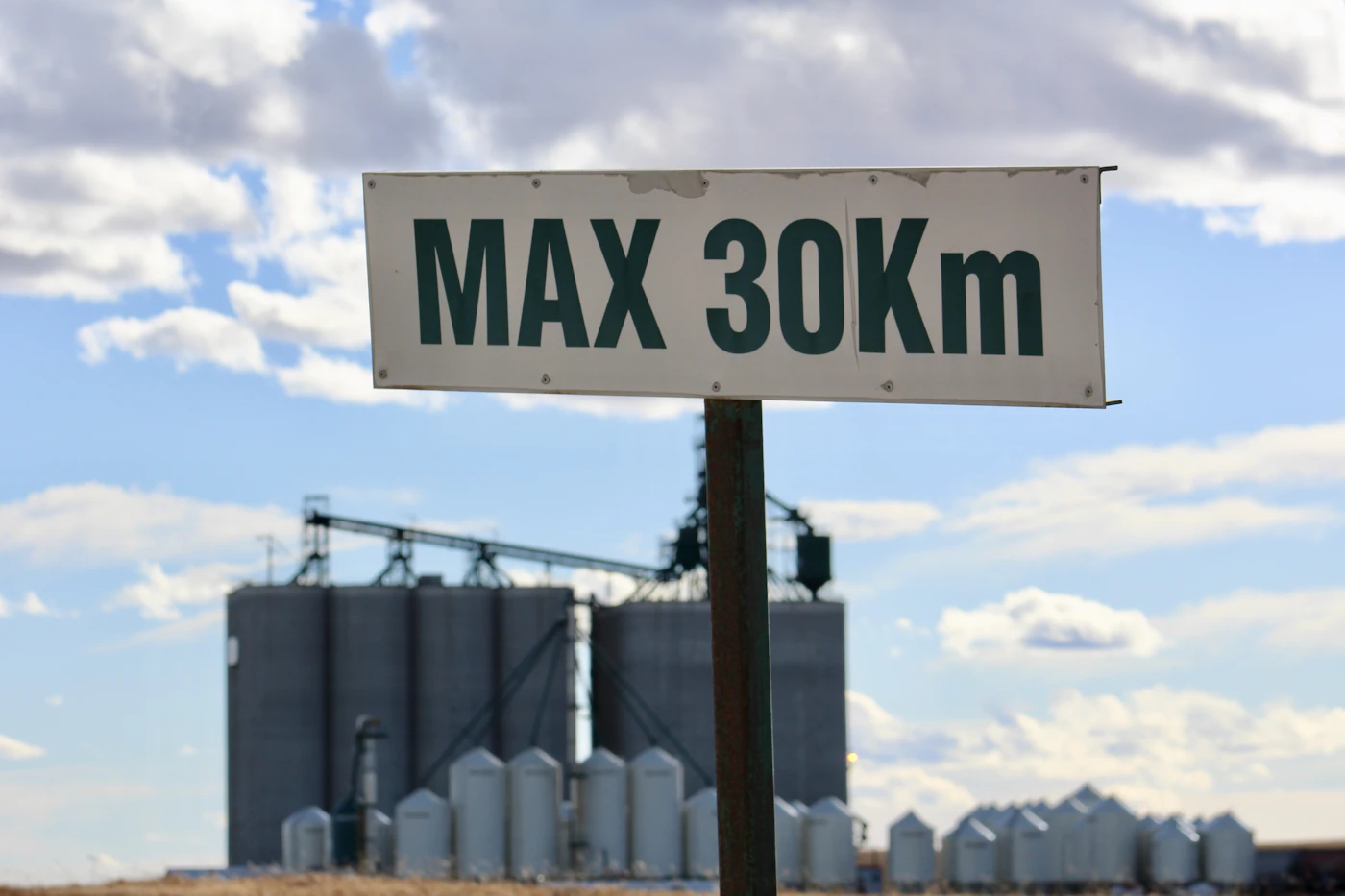 Grain bins and a speed sign in Carstairs, Mountain View County
