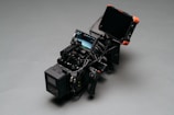 black video camera on gray surface