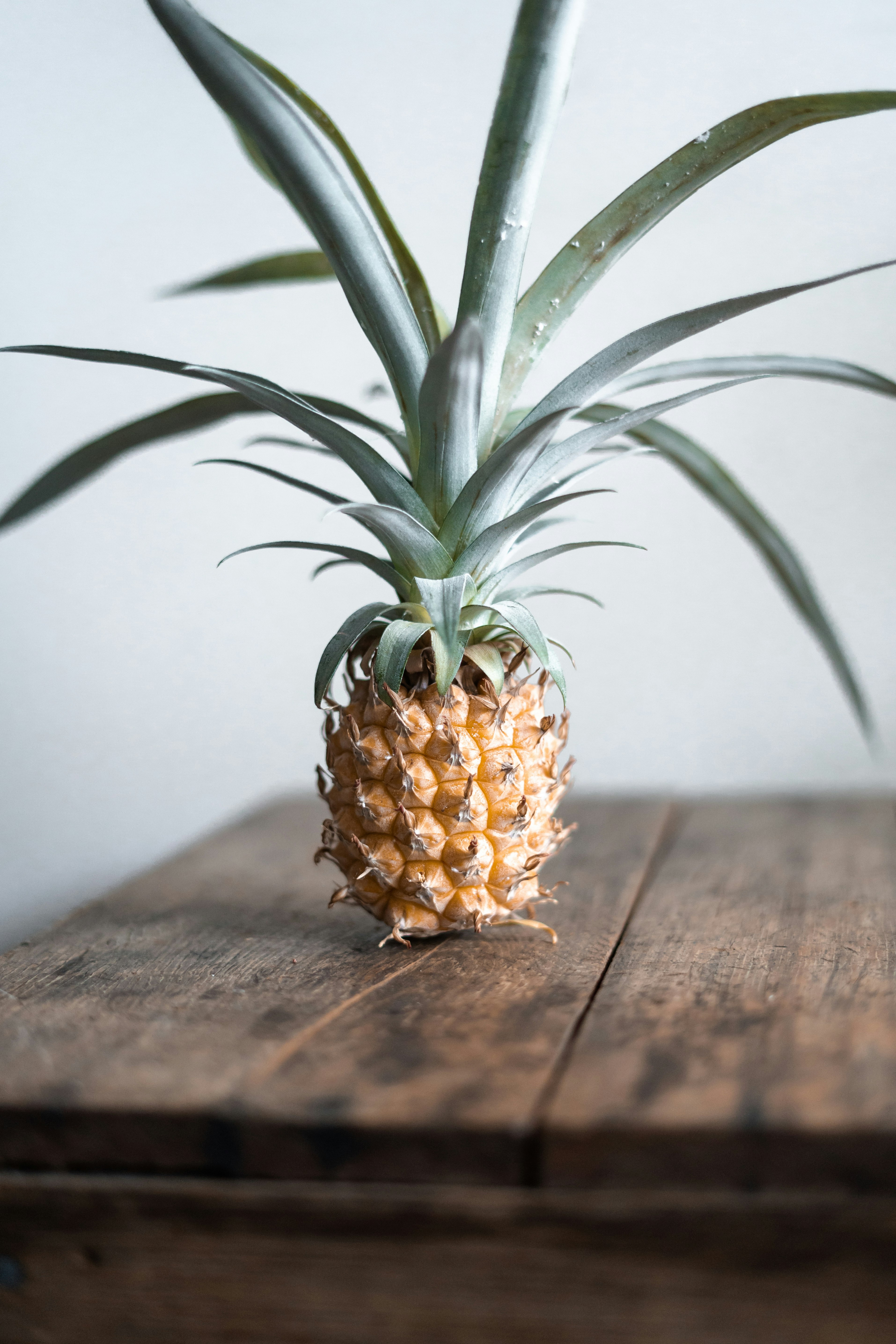 pineapple on top of brown table
