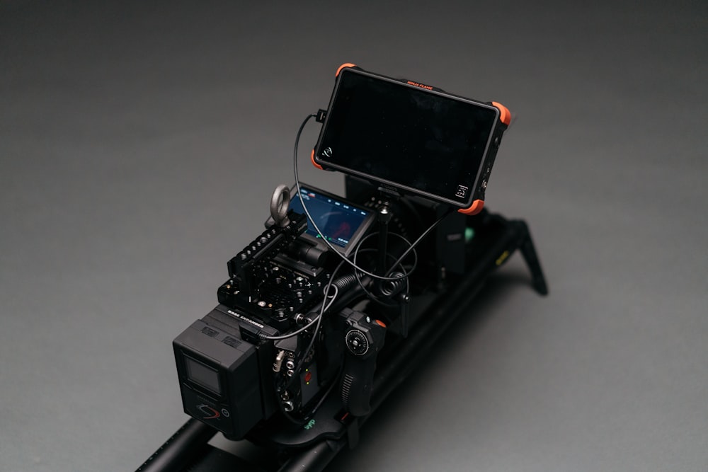black smartphone attached to camera