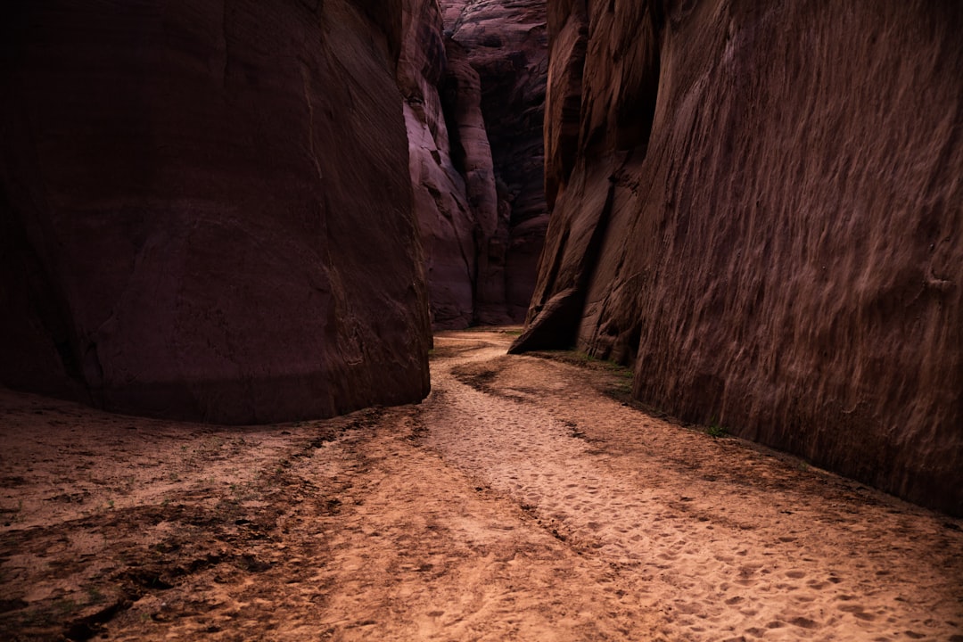 empty pathway between mountains