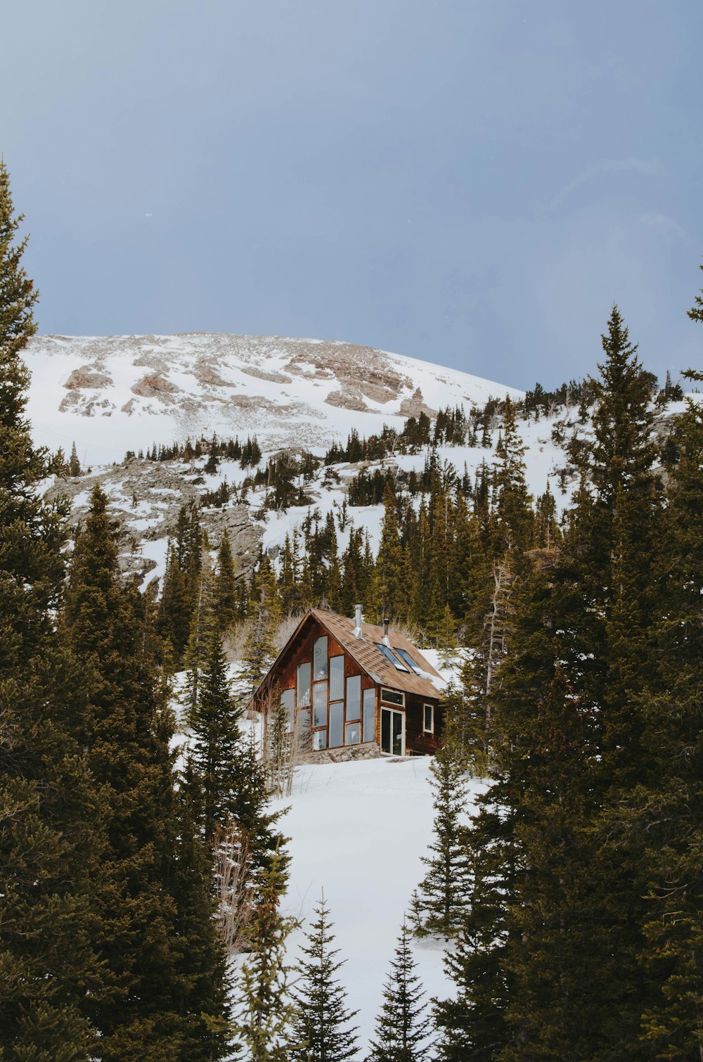 house on mountain near trees during daytime