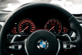 black BMW vehicle steering wheel