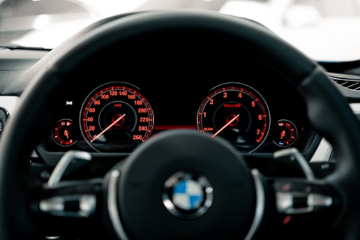 black BMW vehicle steering wheel