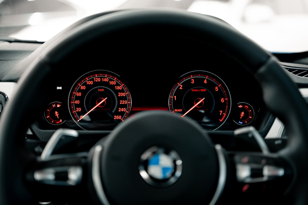 black BMW vehicle steering wheel