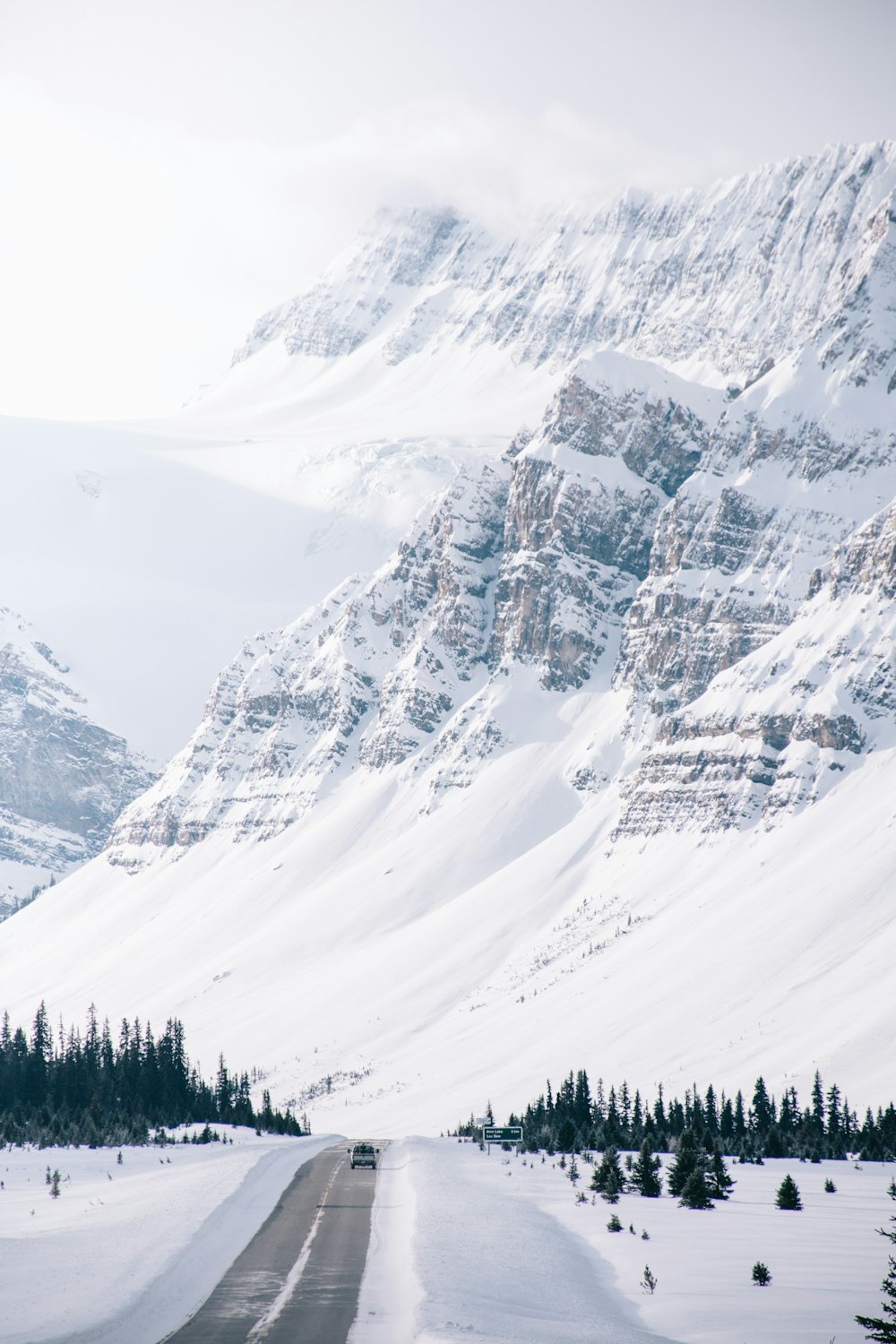 white snow covered hills and road side