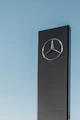 Mercedes-Benz signage under clear blue sky