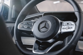 A close-up of a custom steering wheel featuring Alcantara material.