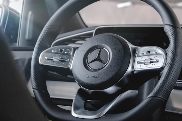 A close-up of a custom steering wheel featuring Alcantara material.