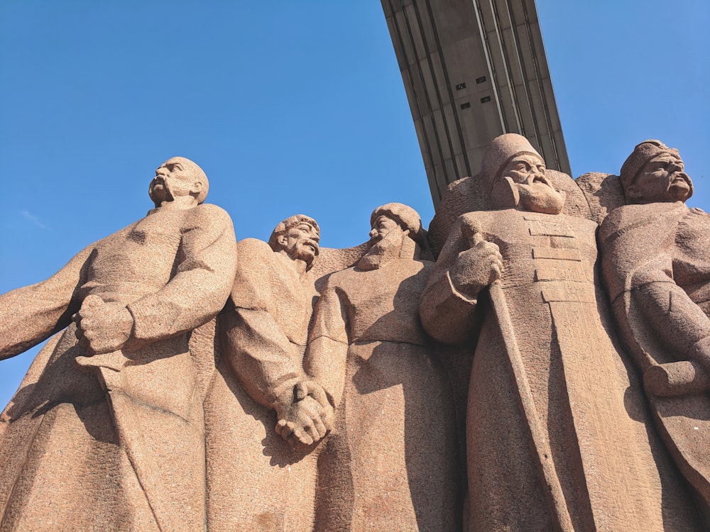 low angle view of men with swords statue