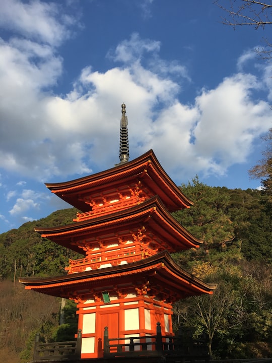 orange and white concrete temple during daytime in Kiyomizu-dera Japan