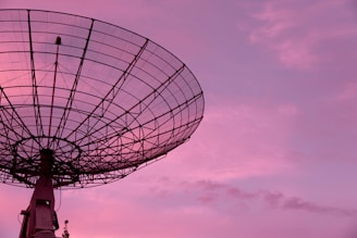 black satellite under blue sky
