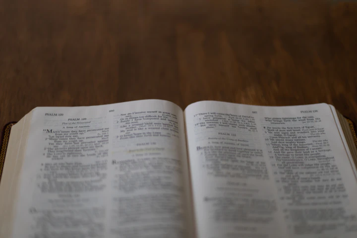 Open Bible on a wooden table