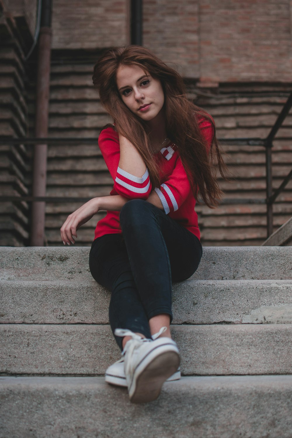 woman sitting on stair