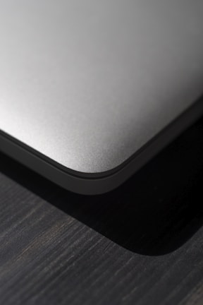 Close-up of the PC's brushed metal finish and clean lines under soft lighting.