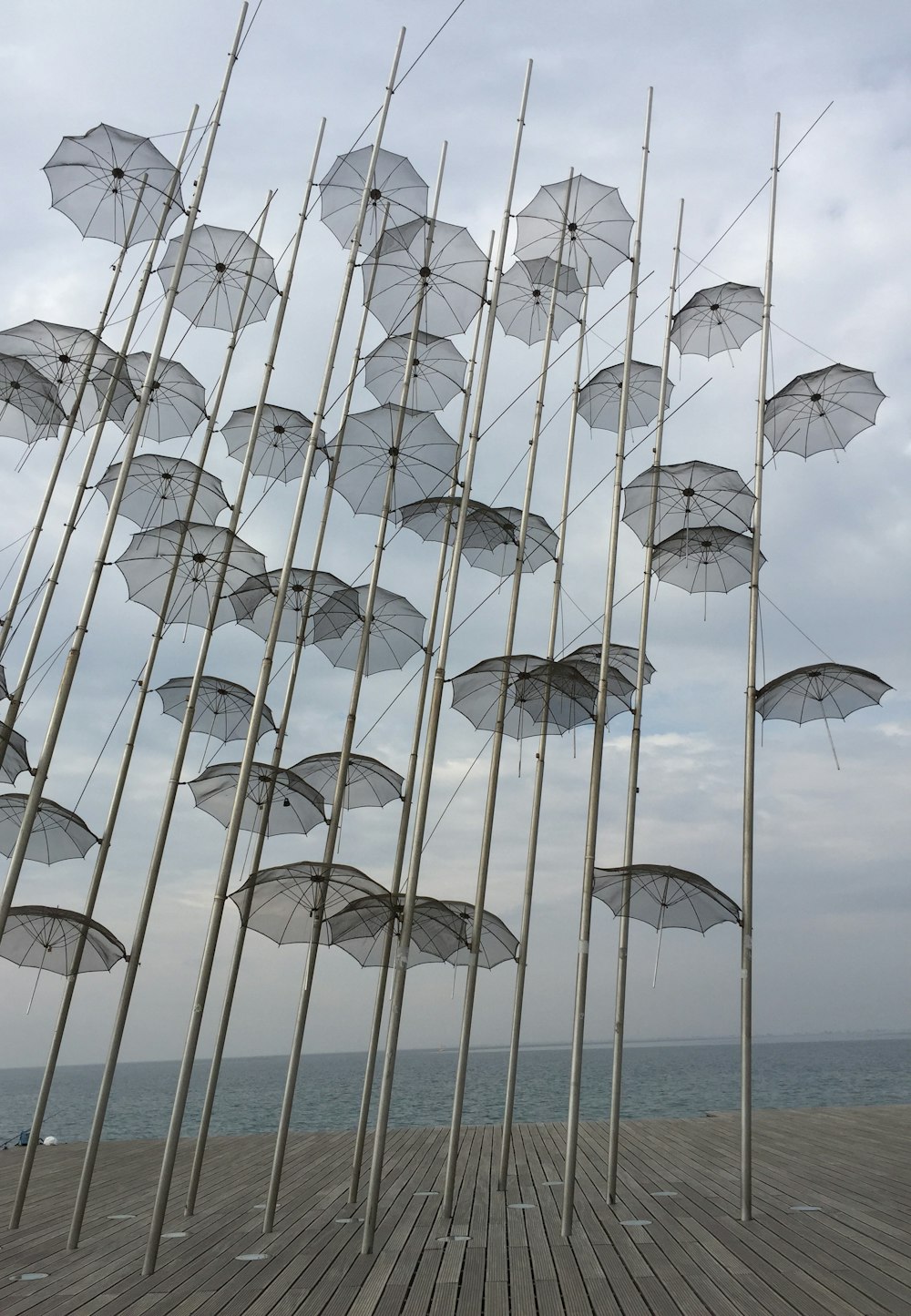 a bunch of umbrellas that are on a pole