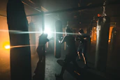 Group training session with energetic boxers under elegant lighting in a premium gym.