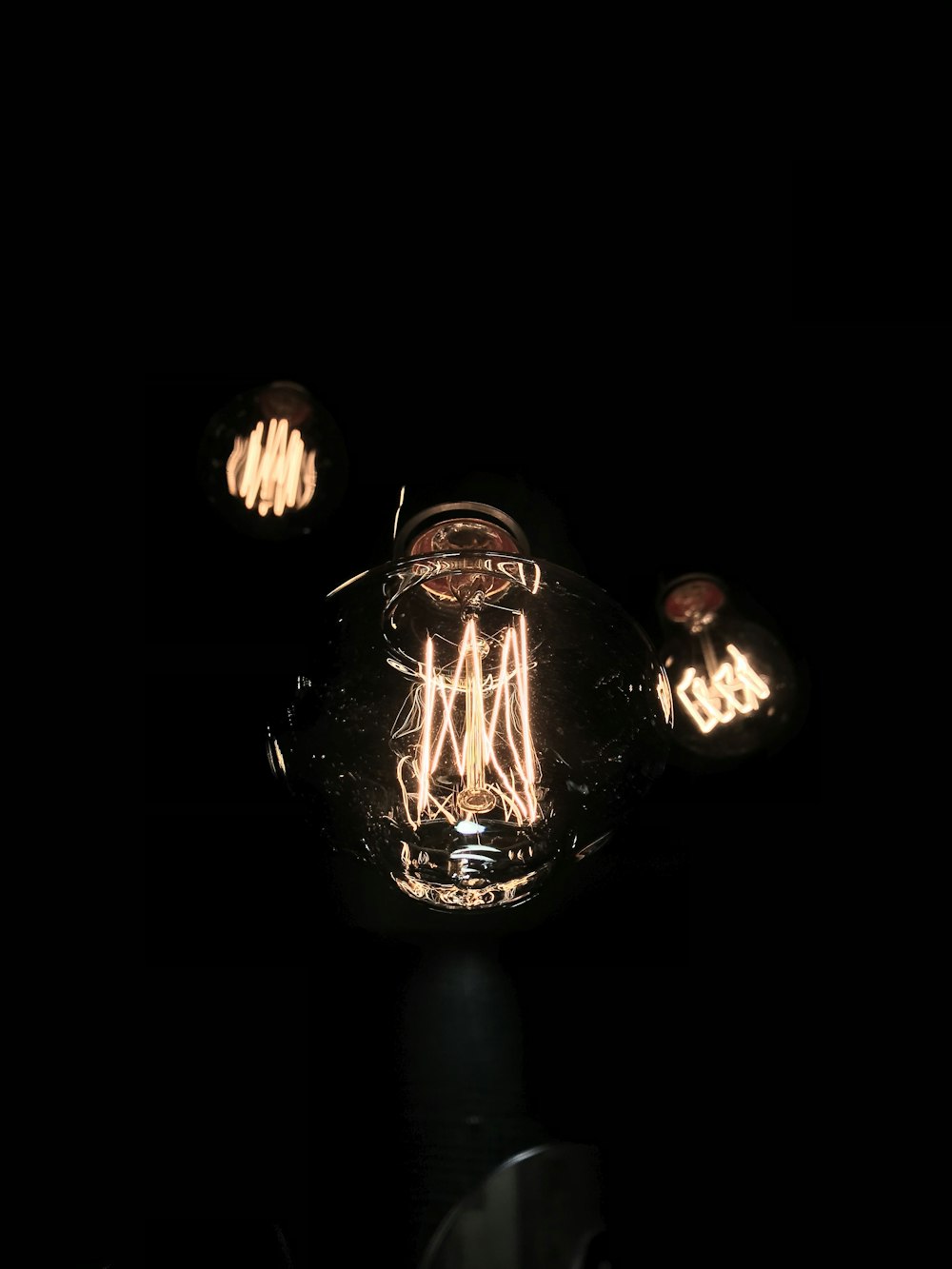 a light bulb that is lit up in the dark