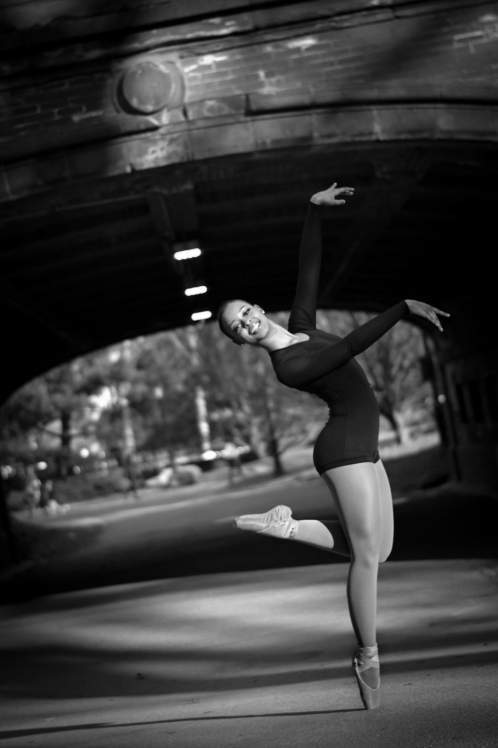 greyscale photo of dancing woman