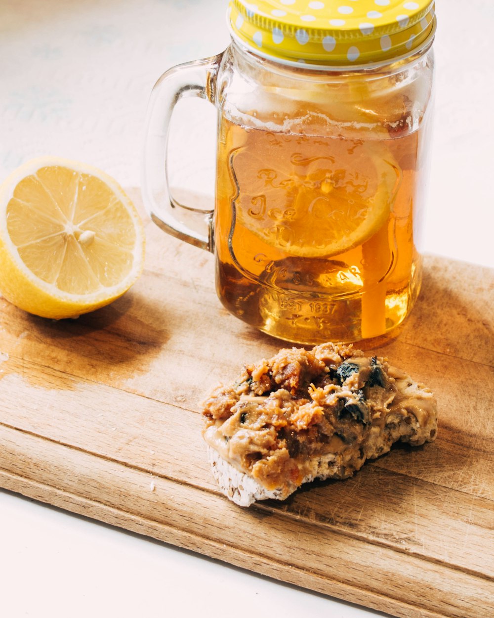 orange fruit beside mug