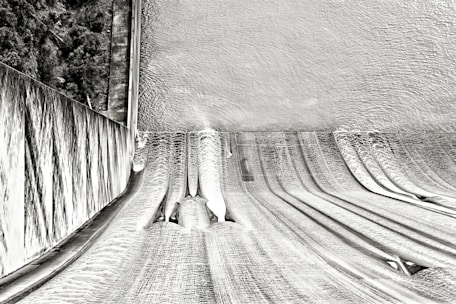A detailed simulation of water flow through a dam spillway, showing velocity and pressure distribution.