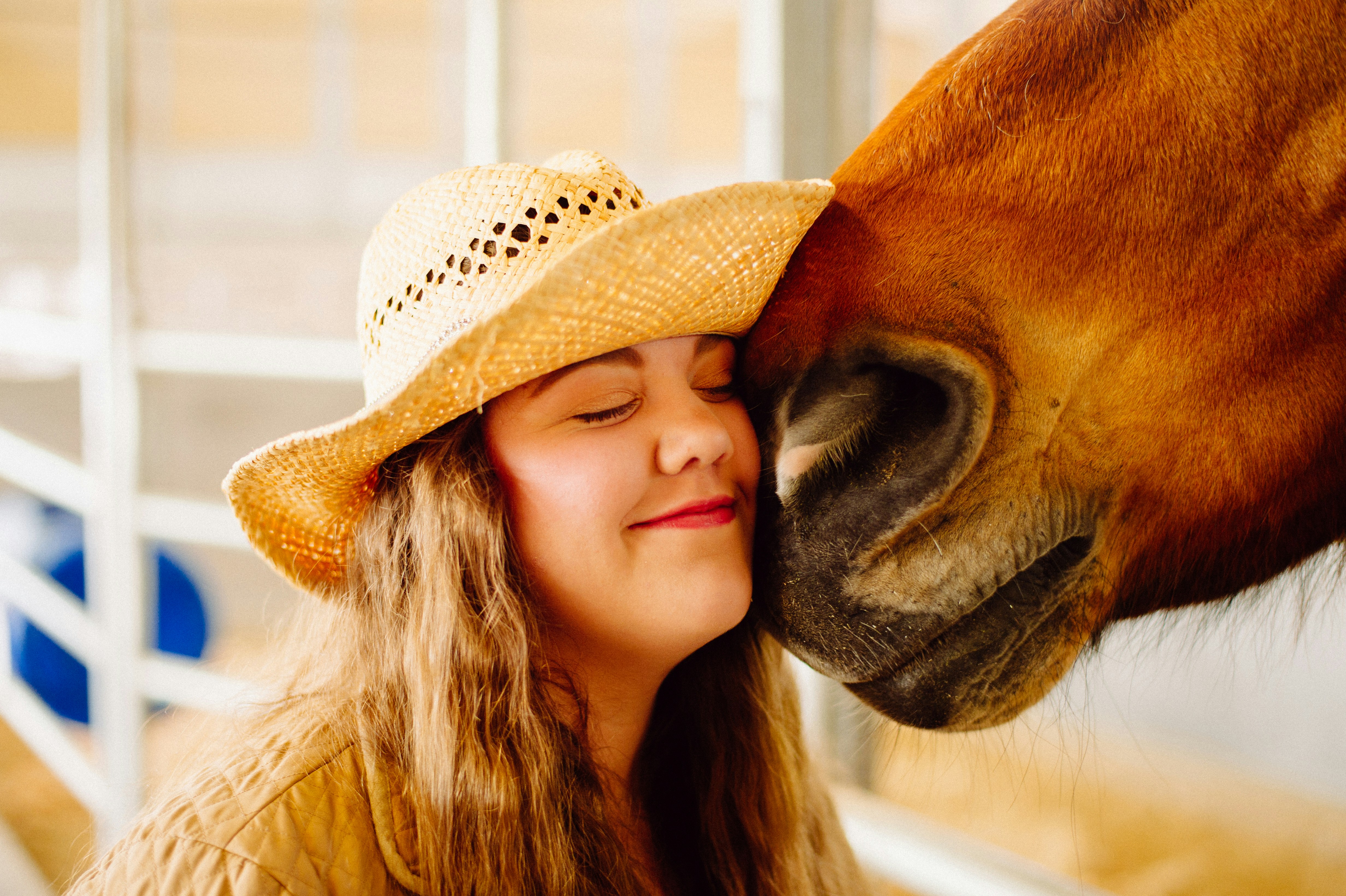 woman's face next to horse
