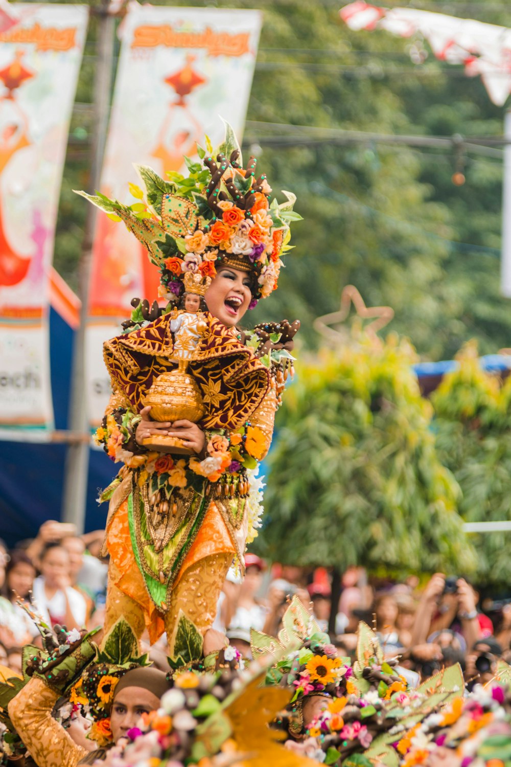 woman in floral costume smiling on focus photography