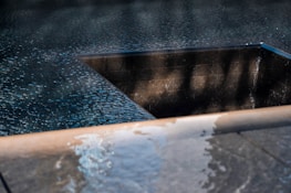 Elegant corporate pool area with smooth edges and ambient water effects.