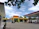Professional exterior of a modern gas station under a clear sky.