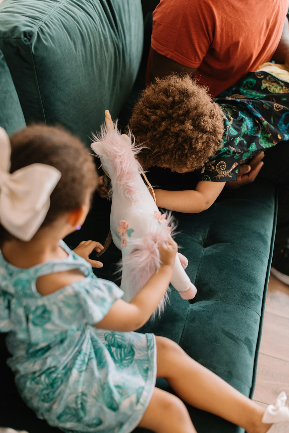 two children playing on sofa