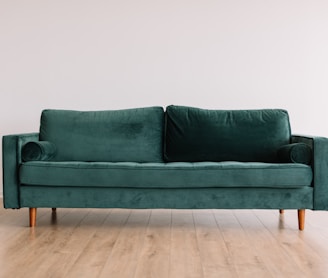 green fabric sofa