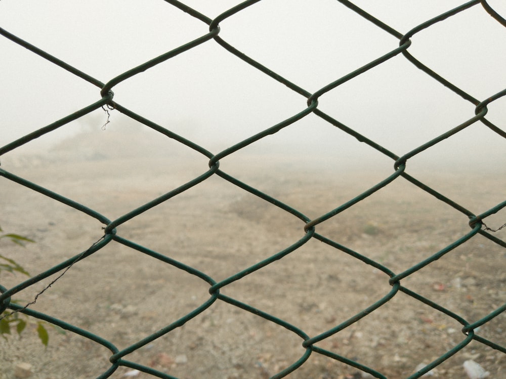gray cyclone fence on focus photography