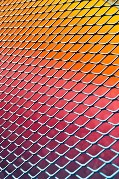 Before and after slider showing a worn chain-link fence replaced by a fresh vinyl fence.