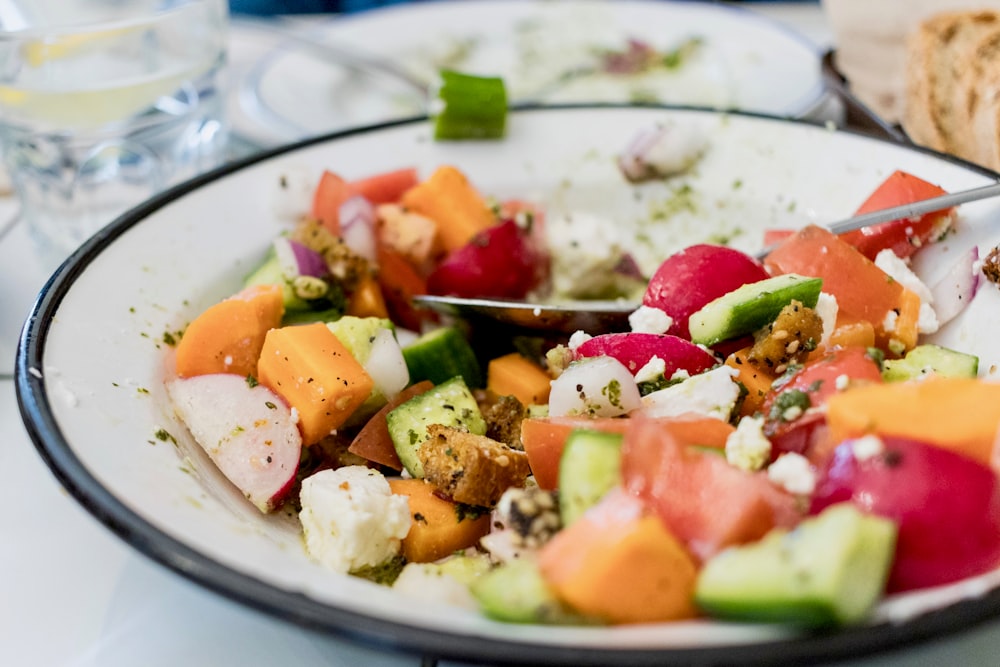 salad on round white plate