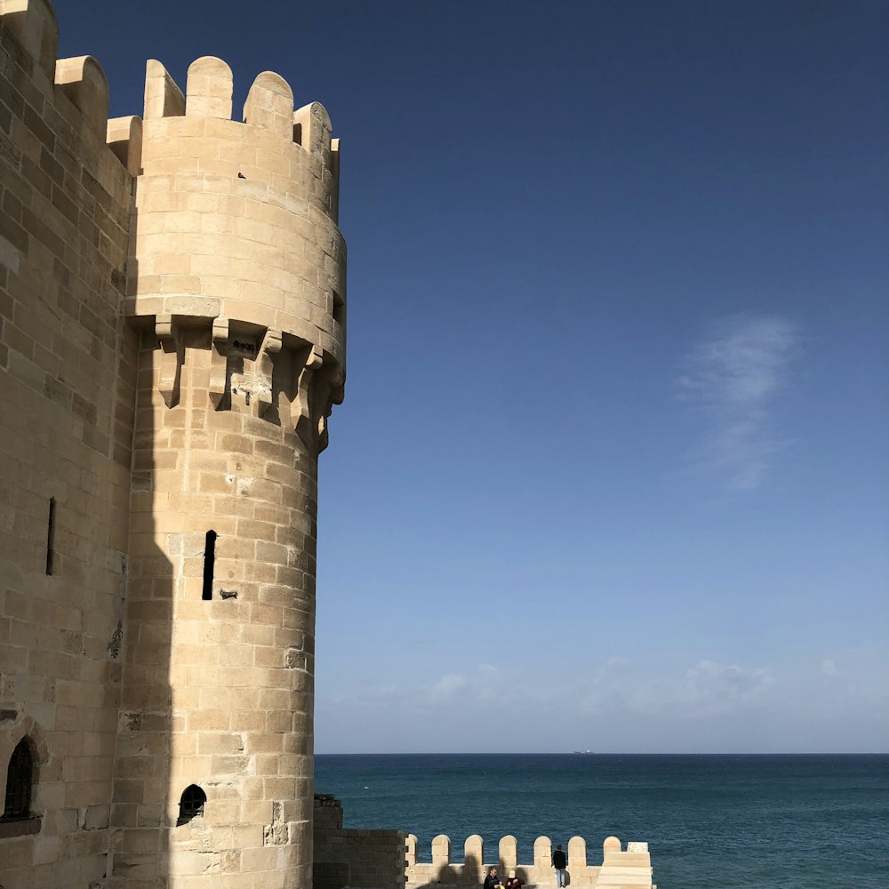 gray brick castle near ocean