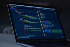 turned-on MacBook Pro wit programming codes display