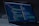 A laptop displays a coding interface with lines of HTML and CSS. The screen shows a dark-themed code editor, possibly for web development, with various tags and attributes visible. The ambient lighting suggests a focused work environment.