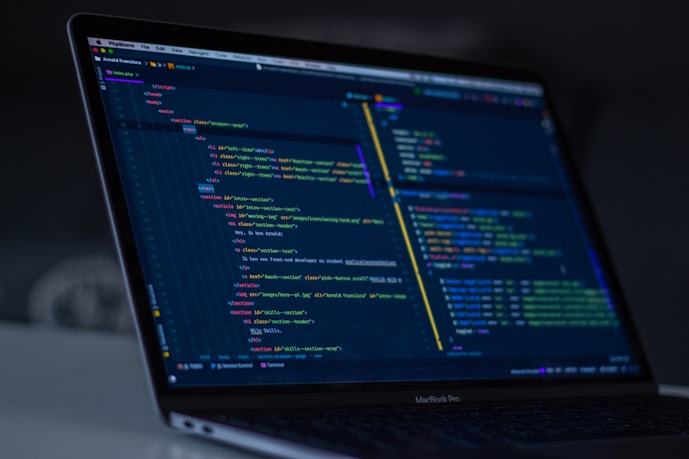 MacBook Pro with code displayed