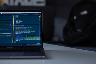 black laptop computer on white surface