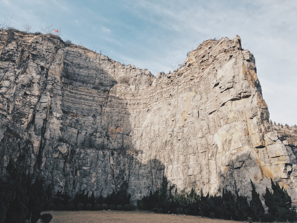 gray land formation under blue sky