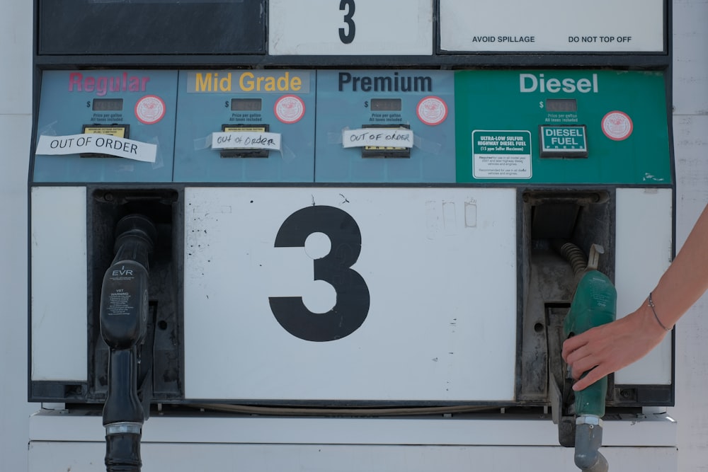 white and green gas pump