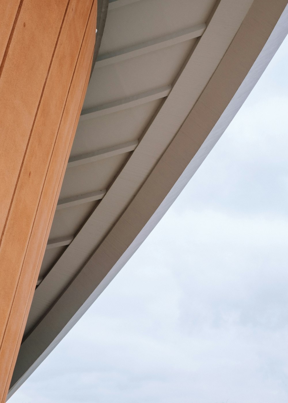 a close up of a wooden door with a sky background