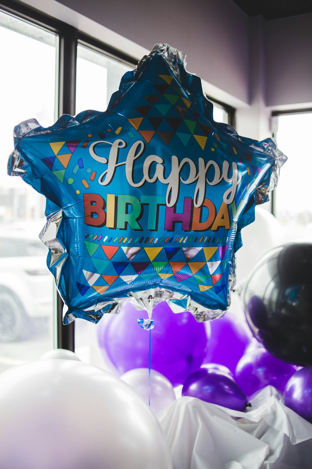 Happy Birthday balloon near window
