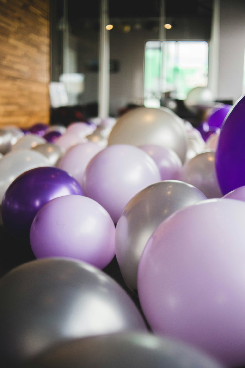 assorted-color balloons inside house