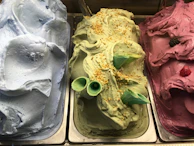 Refreshing granite and gelato served in bright bowls with the pool and greenery blurred in the background.