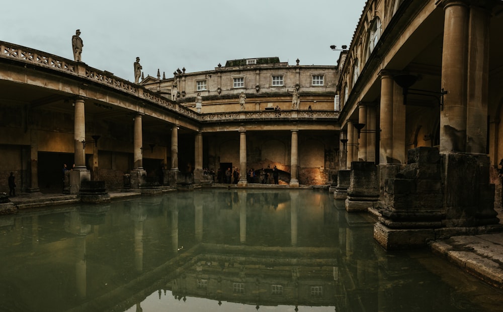 body of water surrounded by brown building