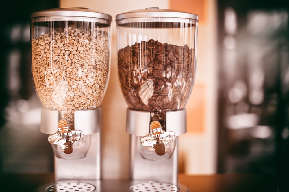 two white cereal dispensers