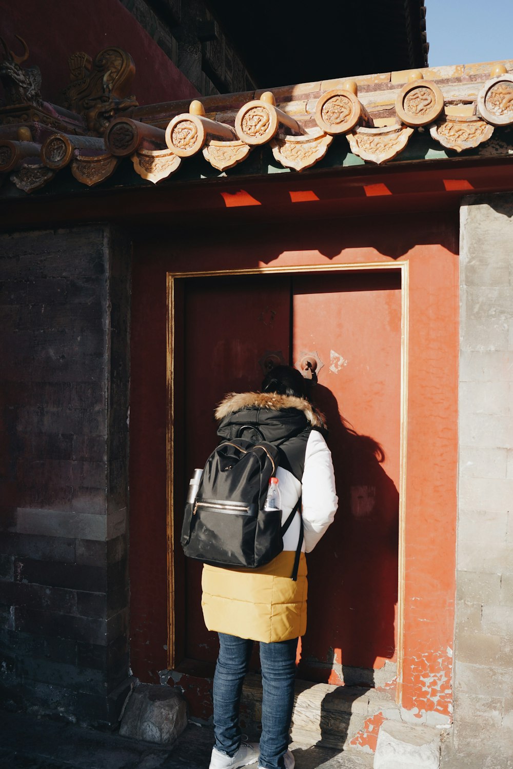 person carrying black backpack