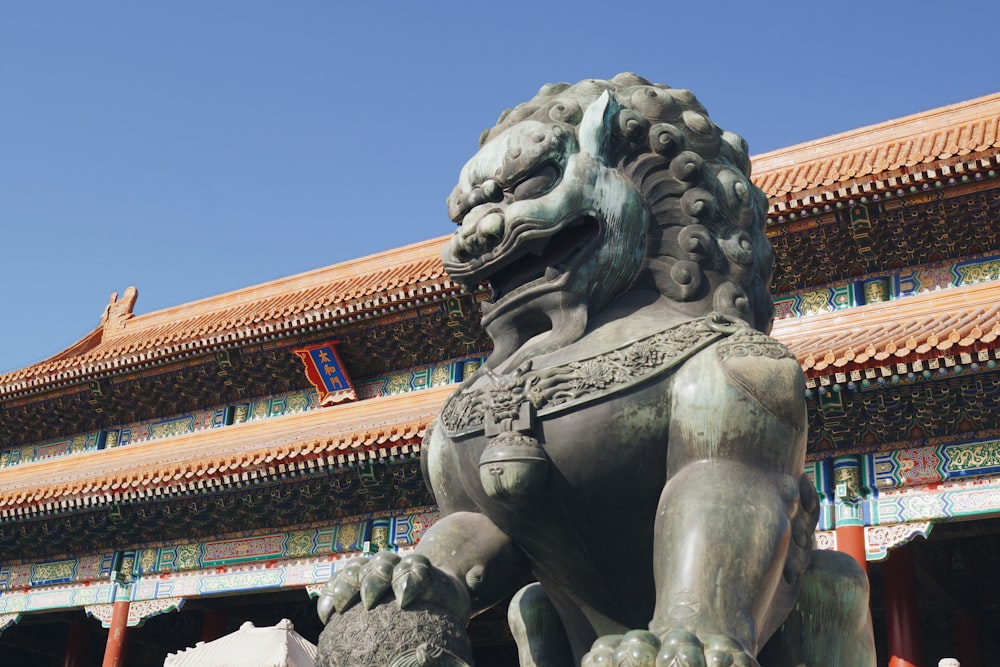 brown animal statue in front of temple