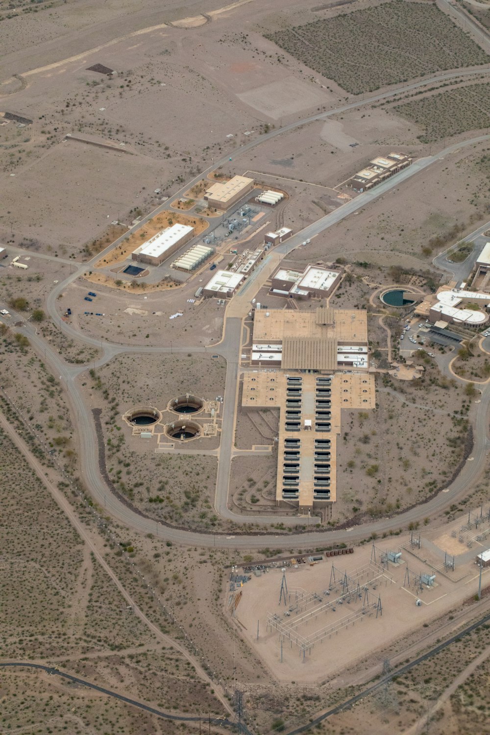 an aerial view of a large building in the middle of a desert